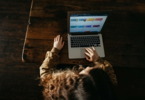 person typing on laptop