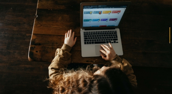 person typing on laptop