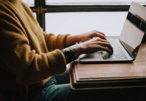 Person typing on laptop