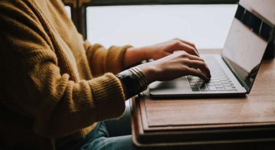 Person typing on laptop