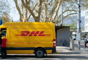 DHL delivery truck parked in the street