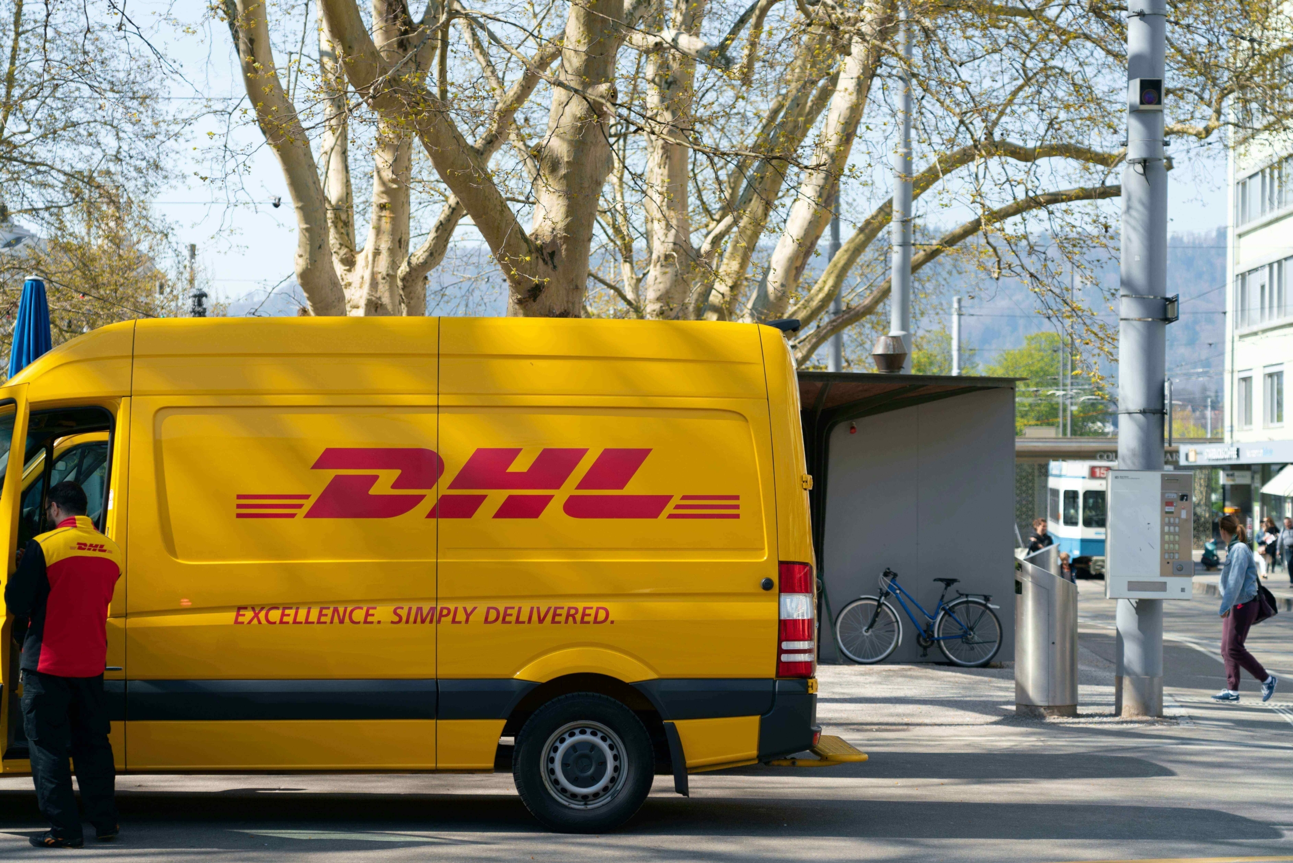 DHL delivery truck parked in the street